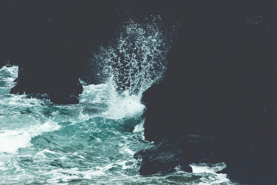 sea waves crashing on rocks