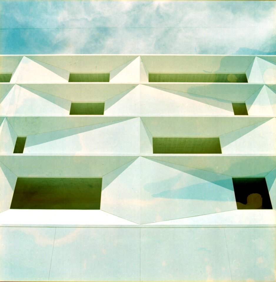 worm's eye view of white and green building