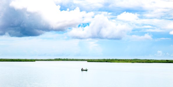 boat at the middle of body of water photo