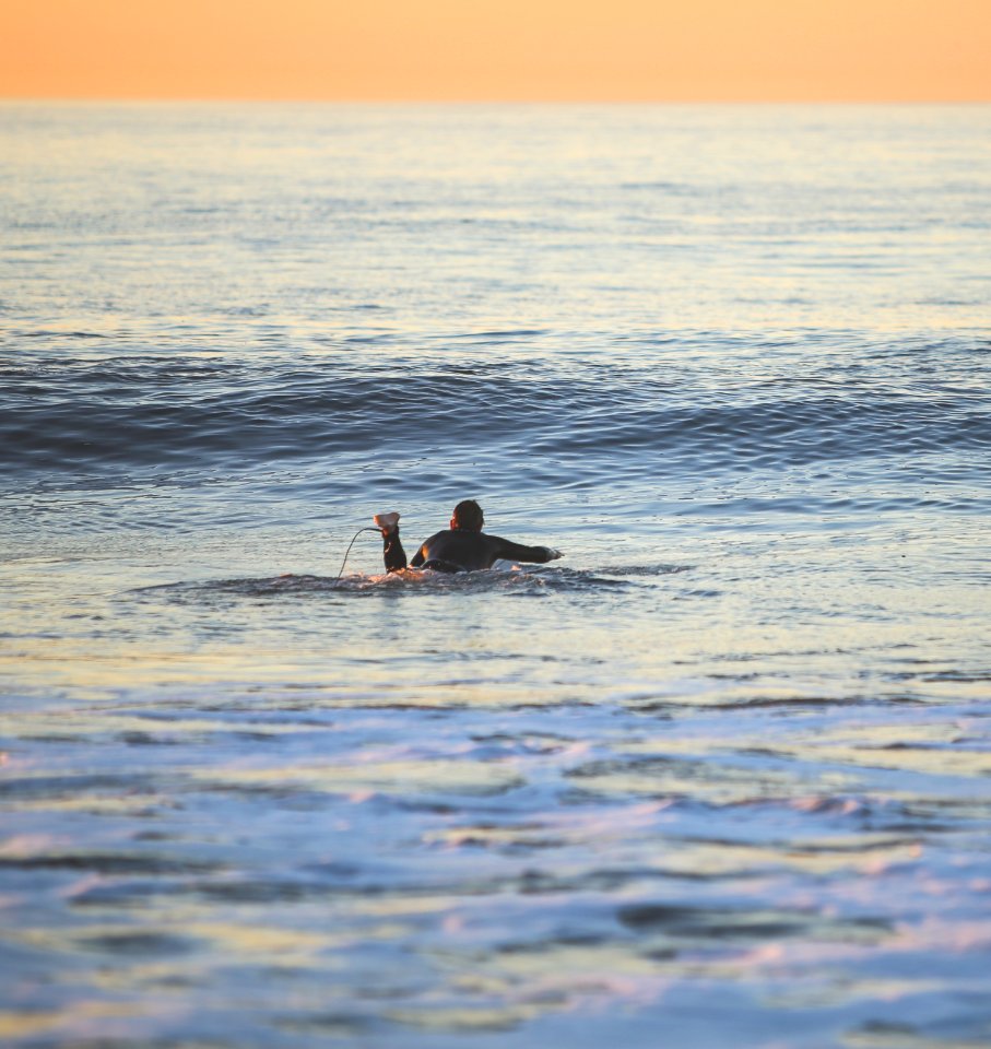 man in water during daytime photo