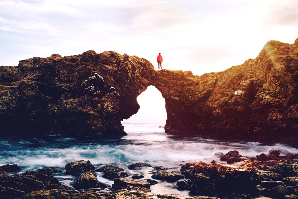 man on cliff photo