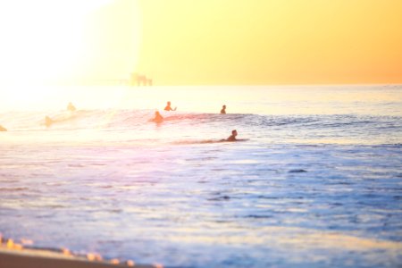 people surfing on beach photo