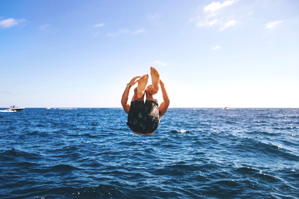 man back tumbling during daytime