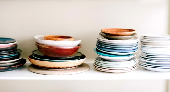 assorted-color ceramic plates and saucers photo