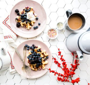 two pancakes with blueberry on top photo