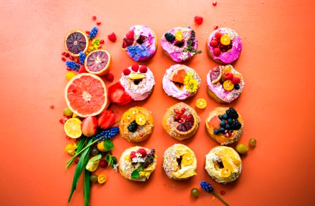 assorted flavor donuts with berries on top