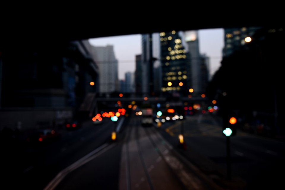 Cityscape at dusk from train tunnel.
