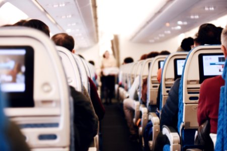 shallow focus photography of people inside of passenger plane photo