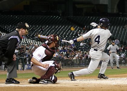 Hitter home plate swing photo