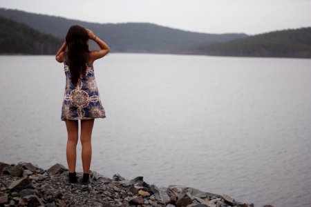 woman standing near water