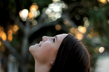 woman looking at the sky during day photo