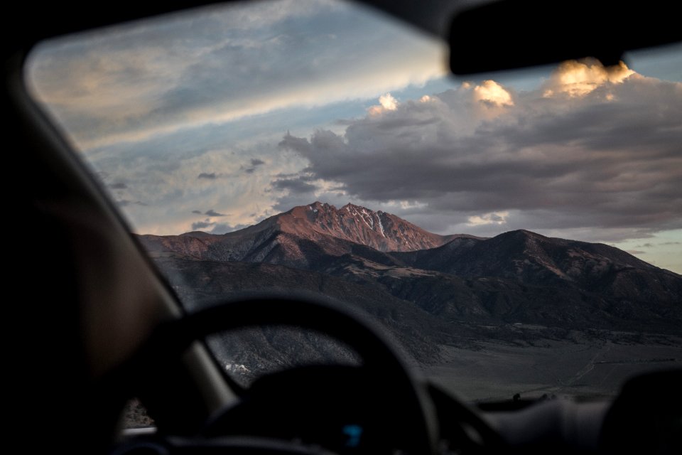brown mountain with cloudy sky