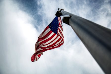 low-angled photography of U.S.A. flag on pole photo