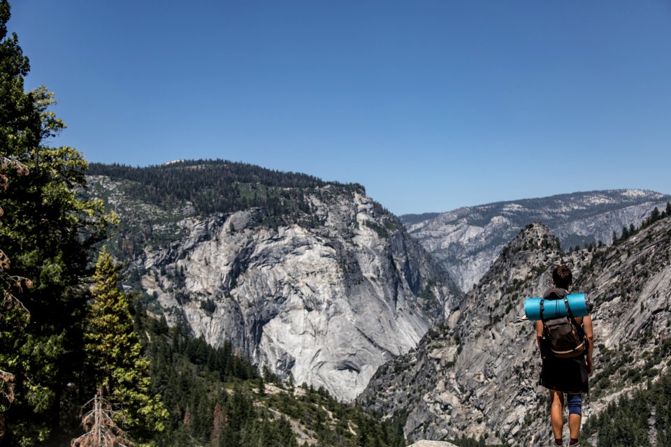 man standing on cliff