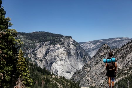 man standing on cliff photo