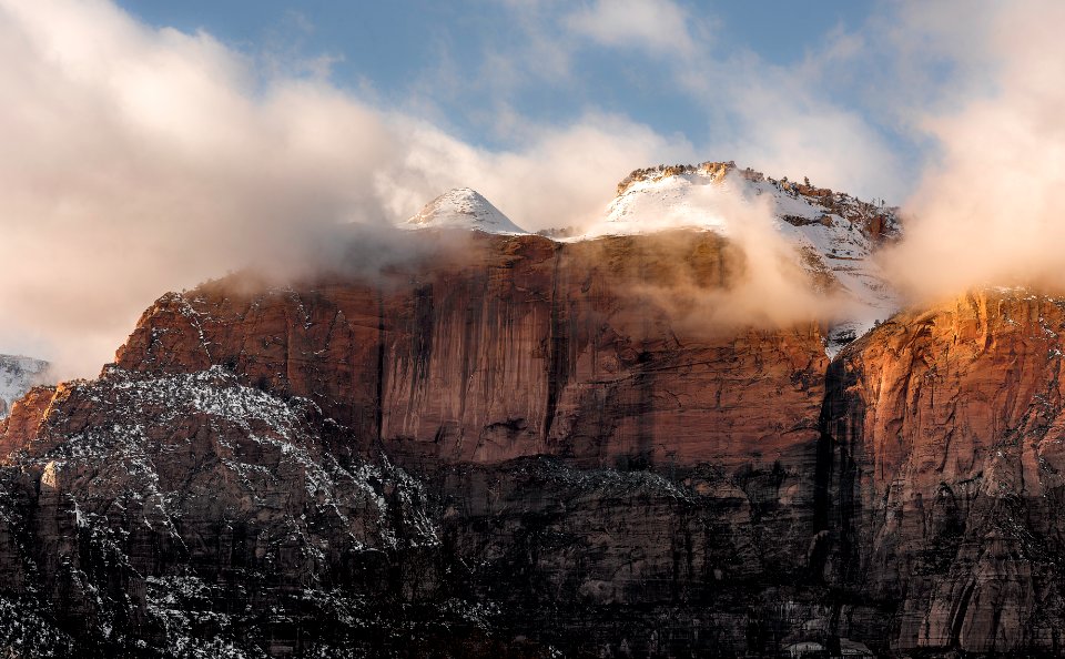 white covered rock mountains under white sky