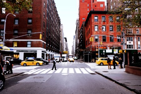 man walking on pedestrian lane photo