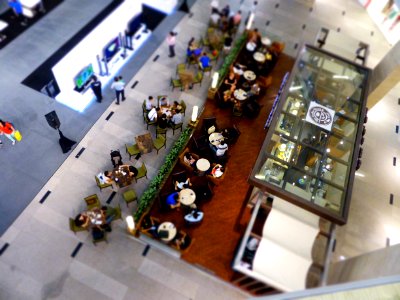 aerial view of people eating inside building during daytime photo