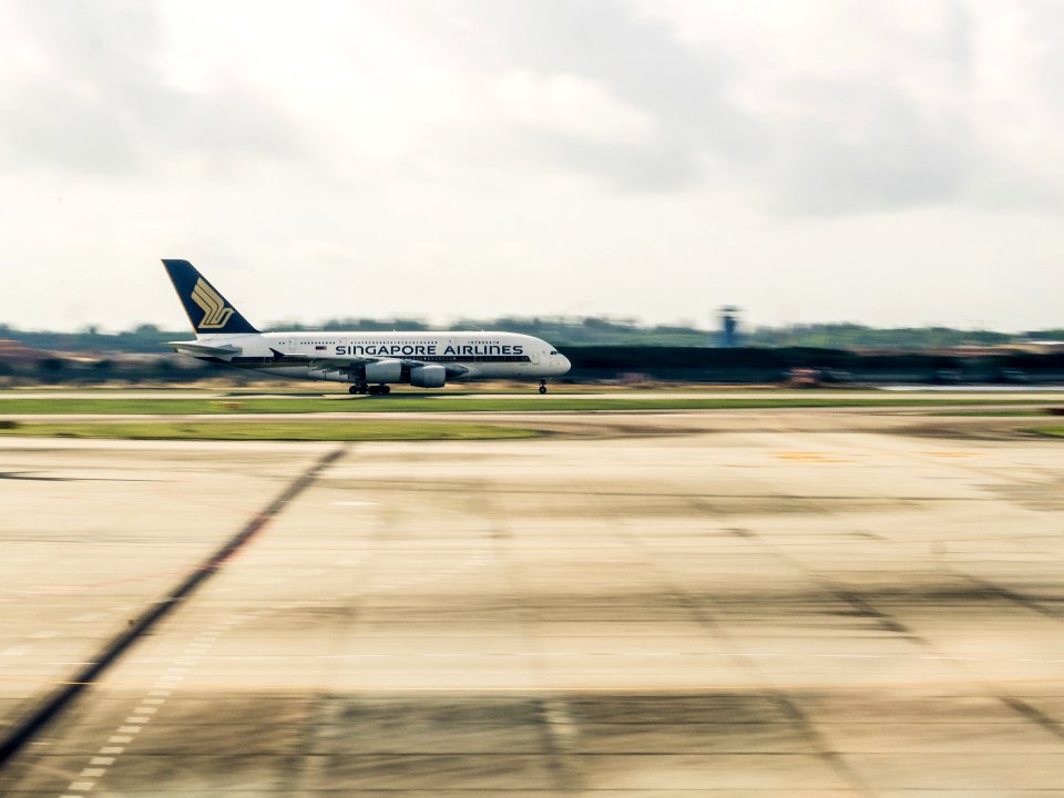 airplane on gray concrete road photo