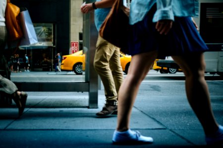 woman walking on road sideways