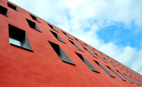 low-angle photography of red concrete building photo
