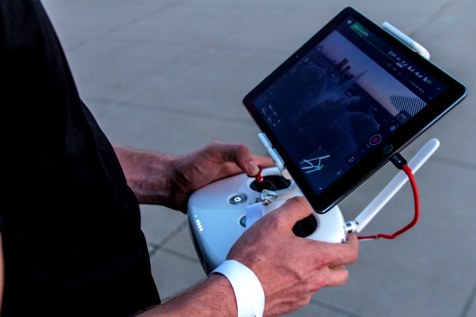 person holding quadcopter controller
