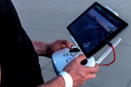 person holding quadcopter controller