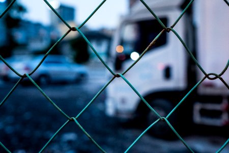 selective focus photography of gray chain link fence photo