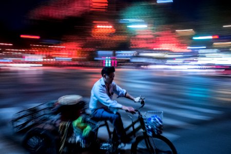 man pedaling his trike photo