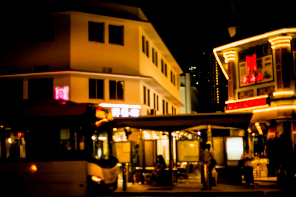 Old buildings, Neon lights, Bus stop