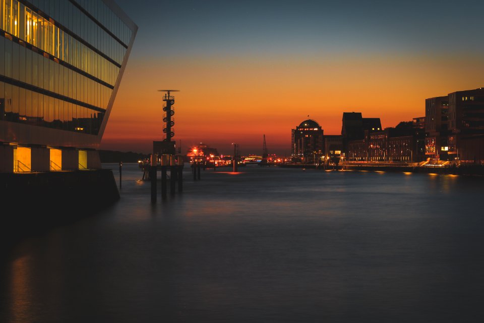photo of a lighted buildings on sunset