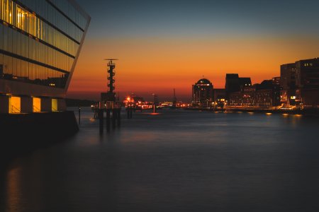 photo of a lighted buildings on sunset