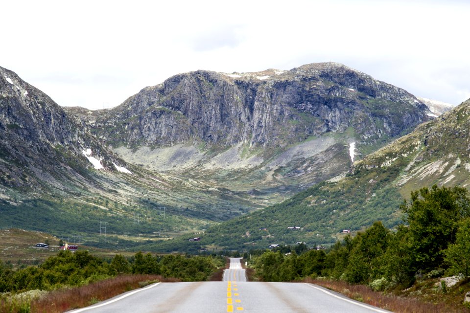 gray concrete road near mountain