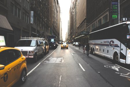 two people walking beside the bus photo