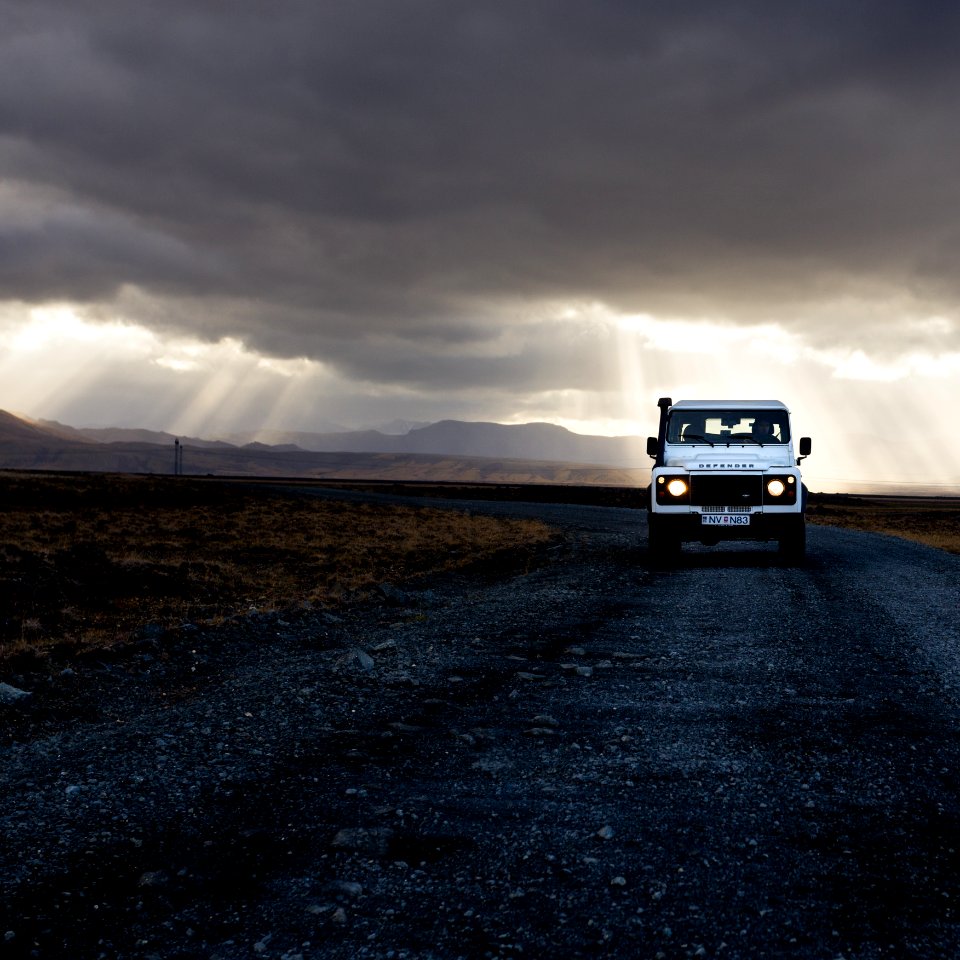 white truck near grass during daytime