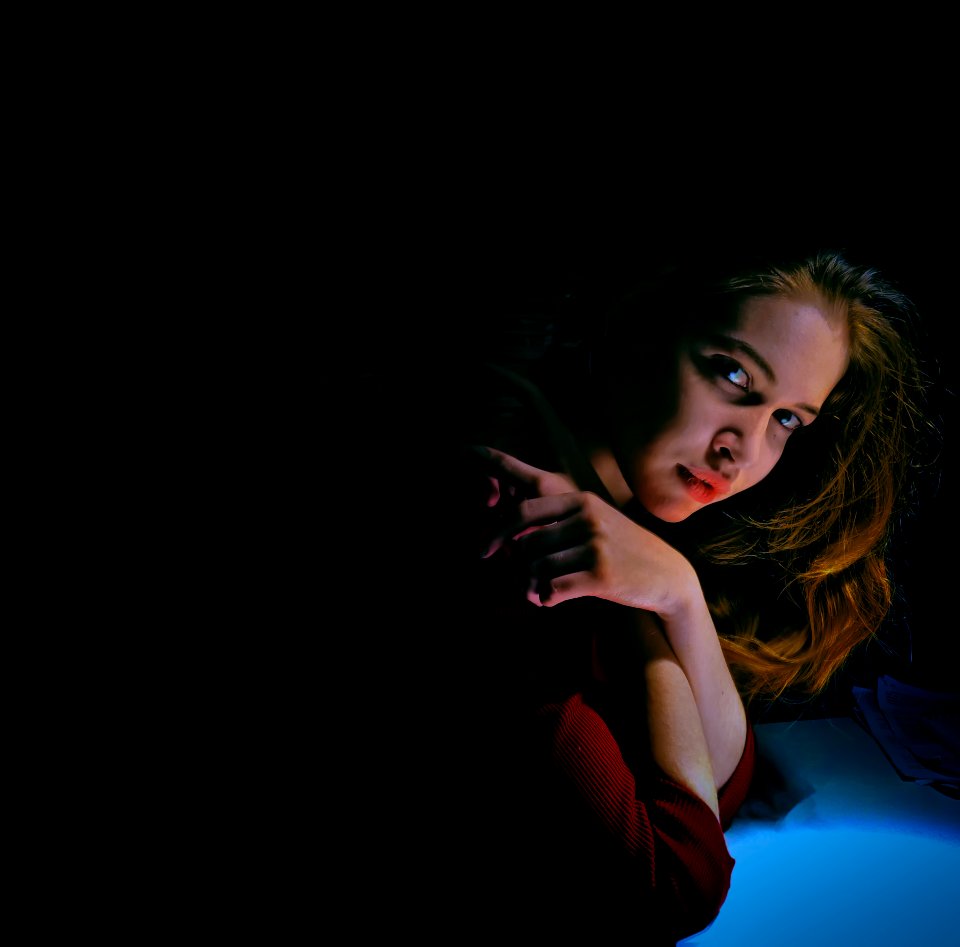 woman crossing her arms while looking at the camera