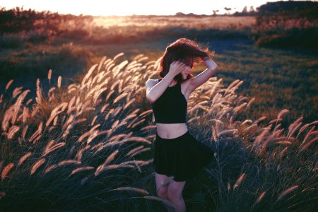 woman dancing on grass field photo