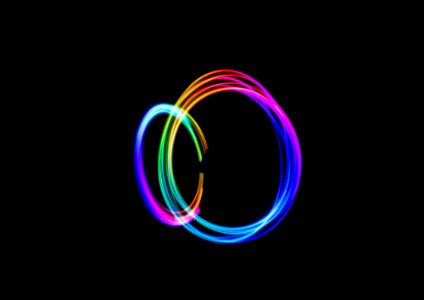 time-lapse photography of person doing circle rainbow light photo