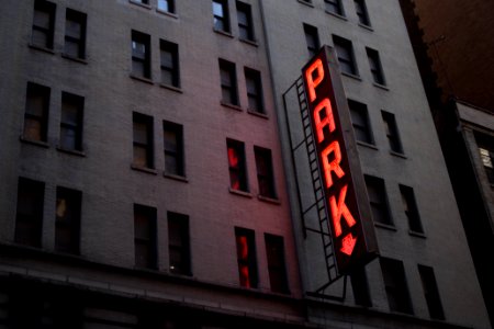red Park light signage on gray concrete building photo