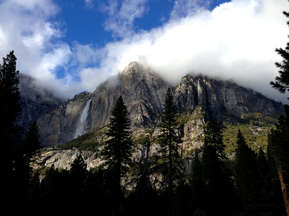 mountain with fog during daytime