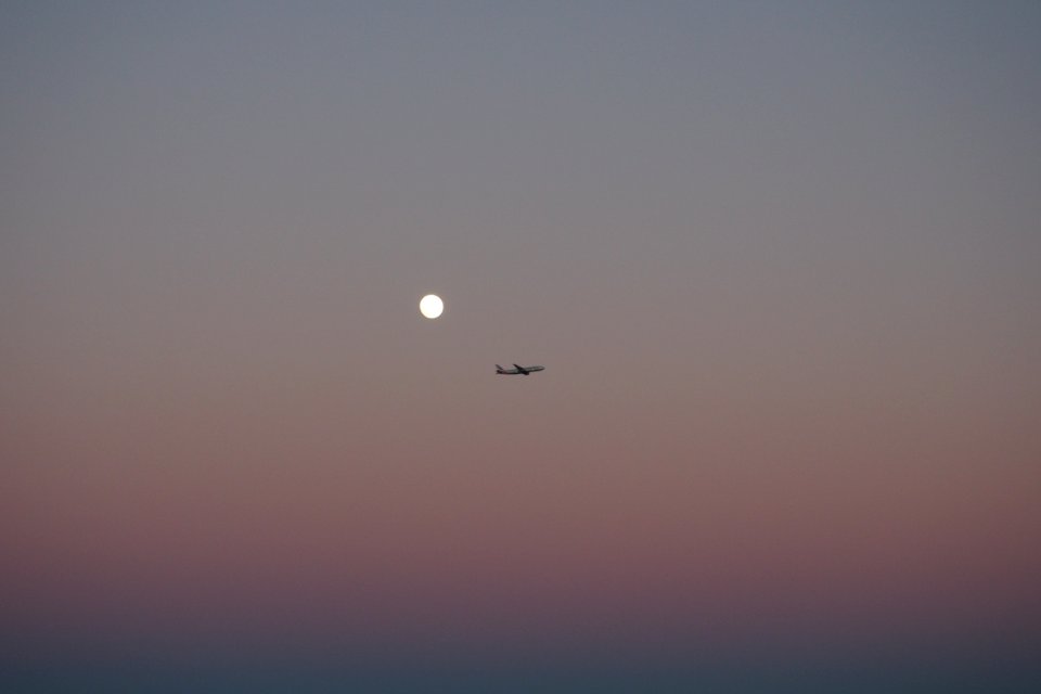silhouette photo of plane on the sky