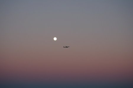 silhouette photo of plane on the sky