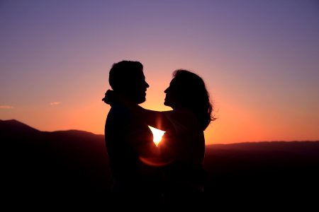 silhouette of hugging couple photo