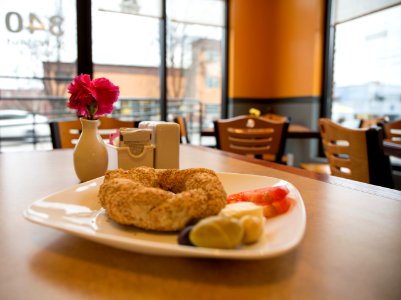 doughnut on white ceramic saucer on table photo