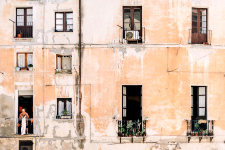 minimalist photography of open windows and doors of building terraces photo