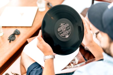 man holding vinyl record