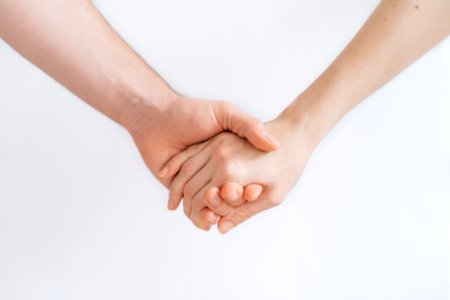 woman and man holding hands photo