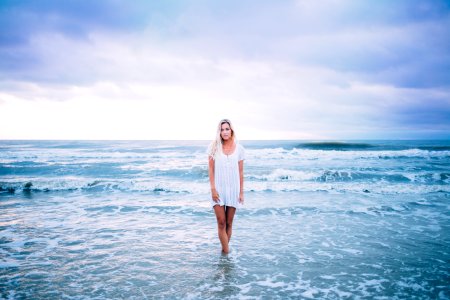 woman standing at sea photo