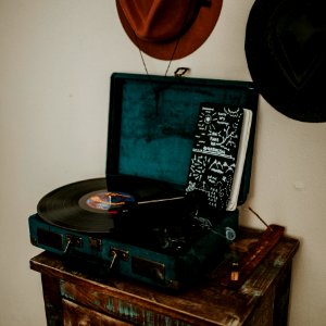 black and blue turntable on brown wooden side table photo