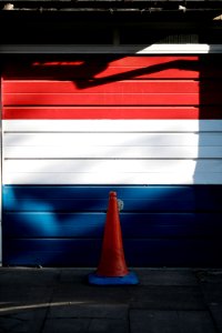red, white , and blue wooden garage door